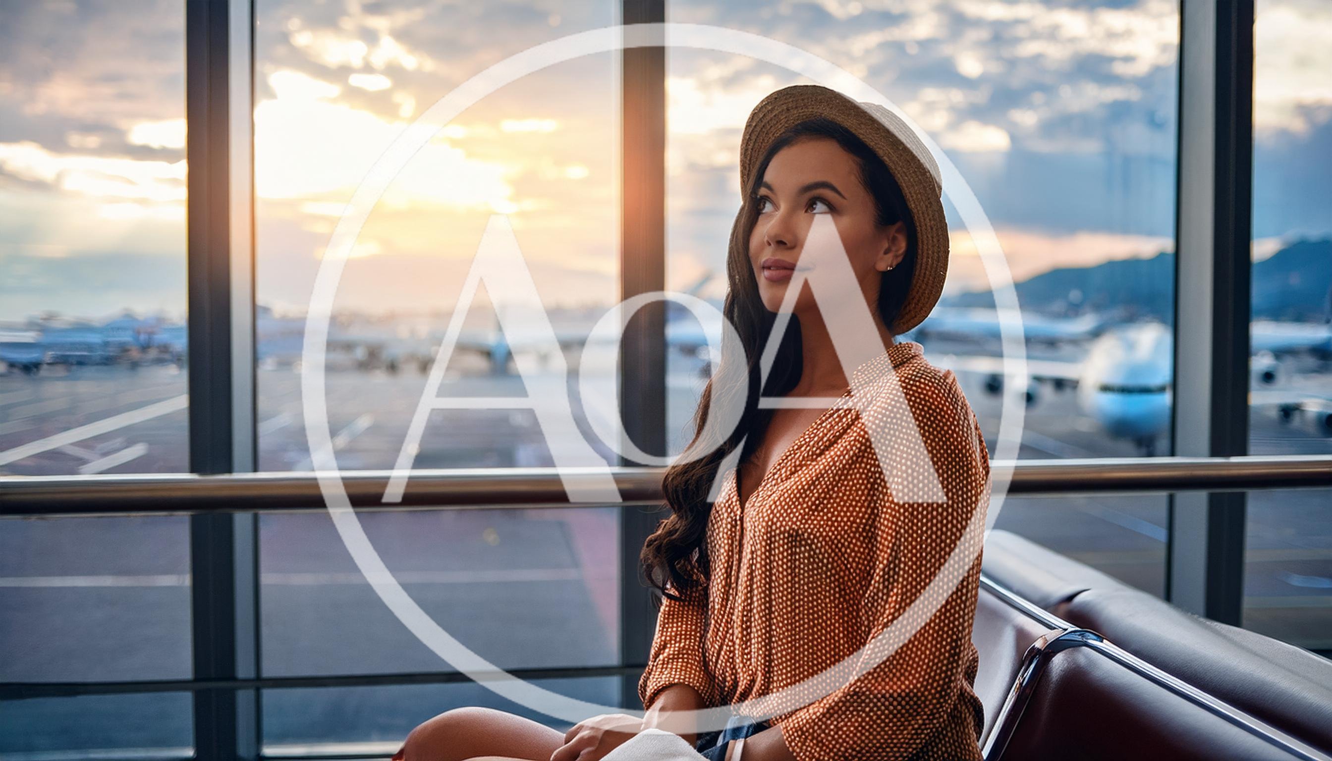 Young Woman Waiting At Airport Terminal During Sunset