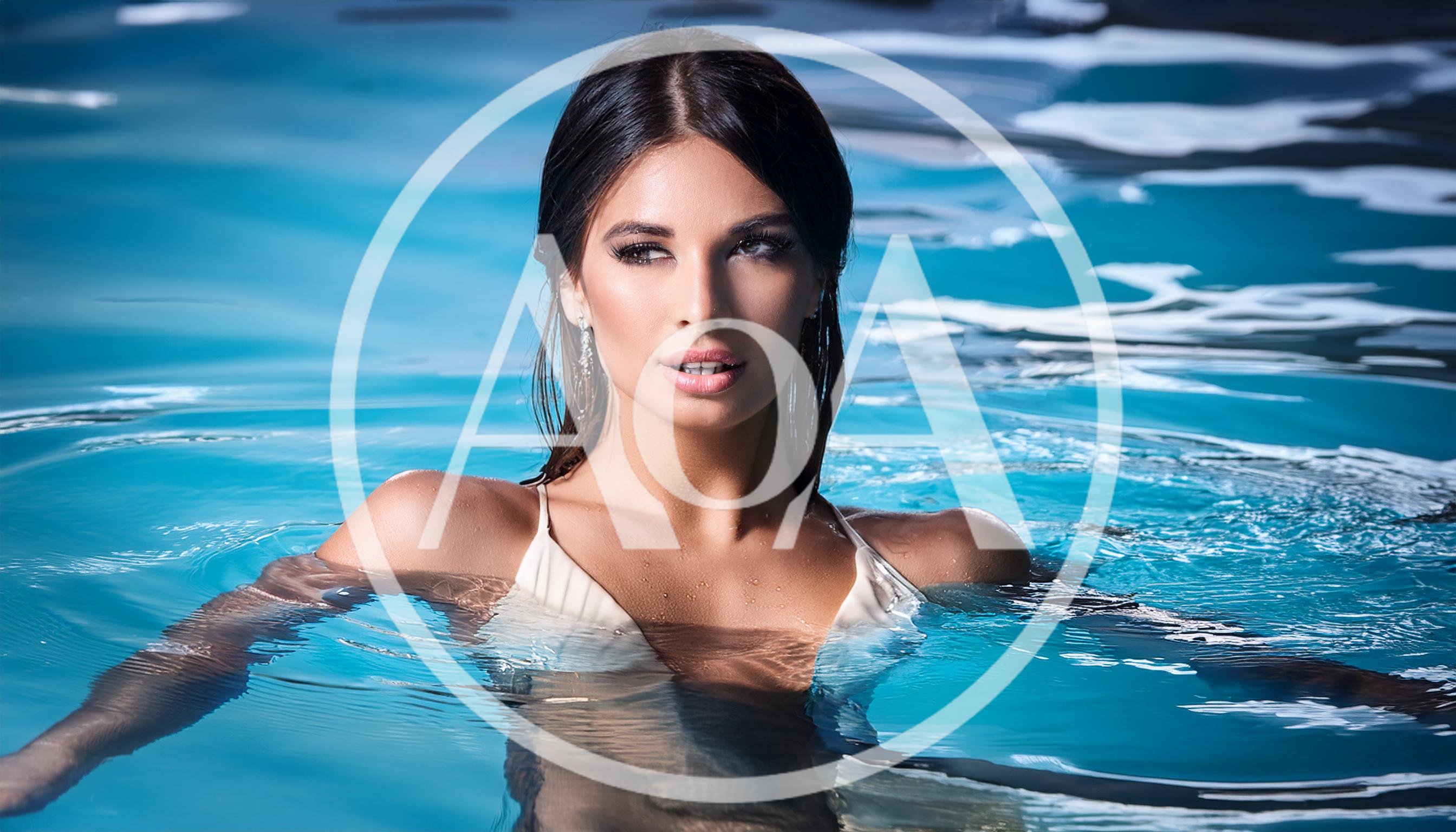 Beautiful Woman Posing In A Swimming Pool