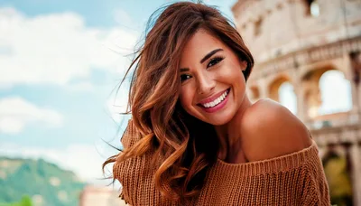 Smiling Woman Posing In Front Of The Roman Colosseum
