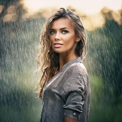 Beautiful Woman Standing In The Rain