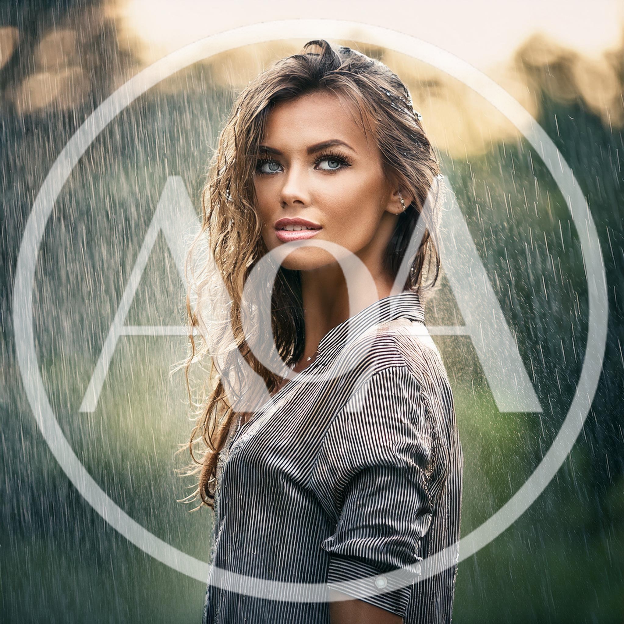 Beautiful Woman Standing In The Rain