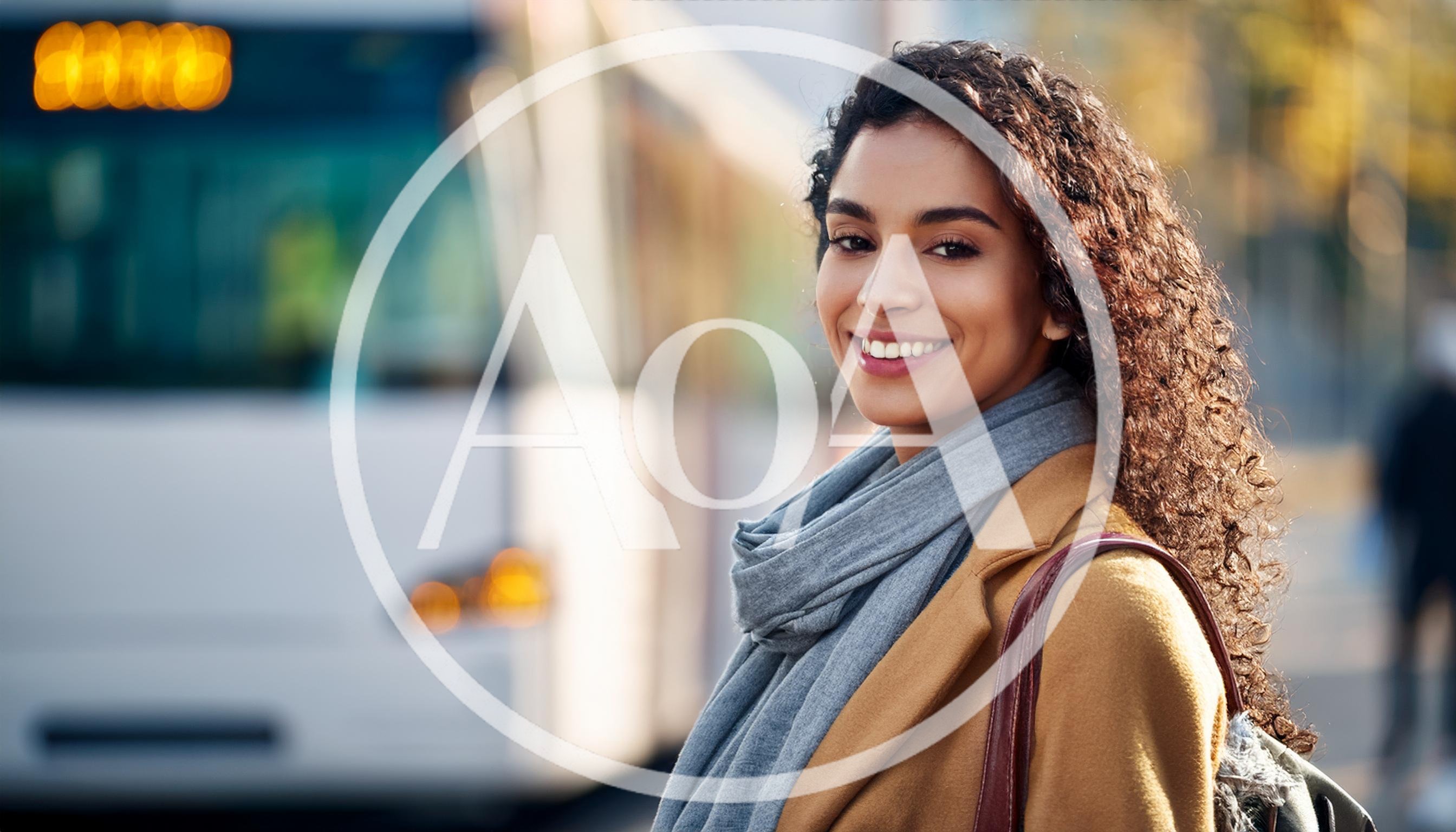 Smiling Woman Waiting For A Bus In The City