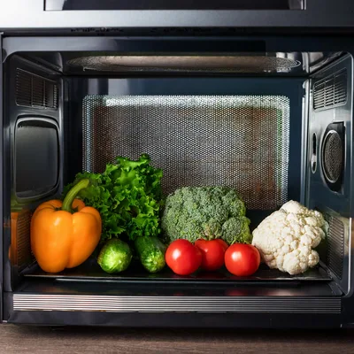 Fresh Vegetables Arranged Inside A Microwave Oven