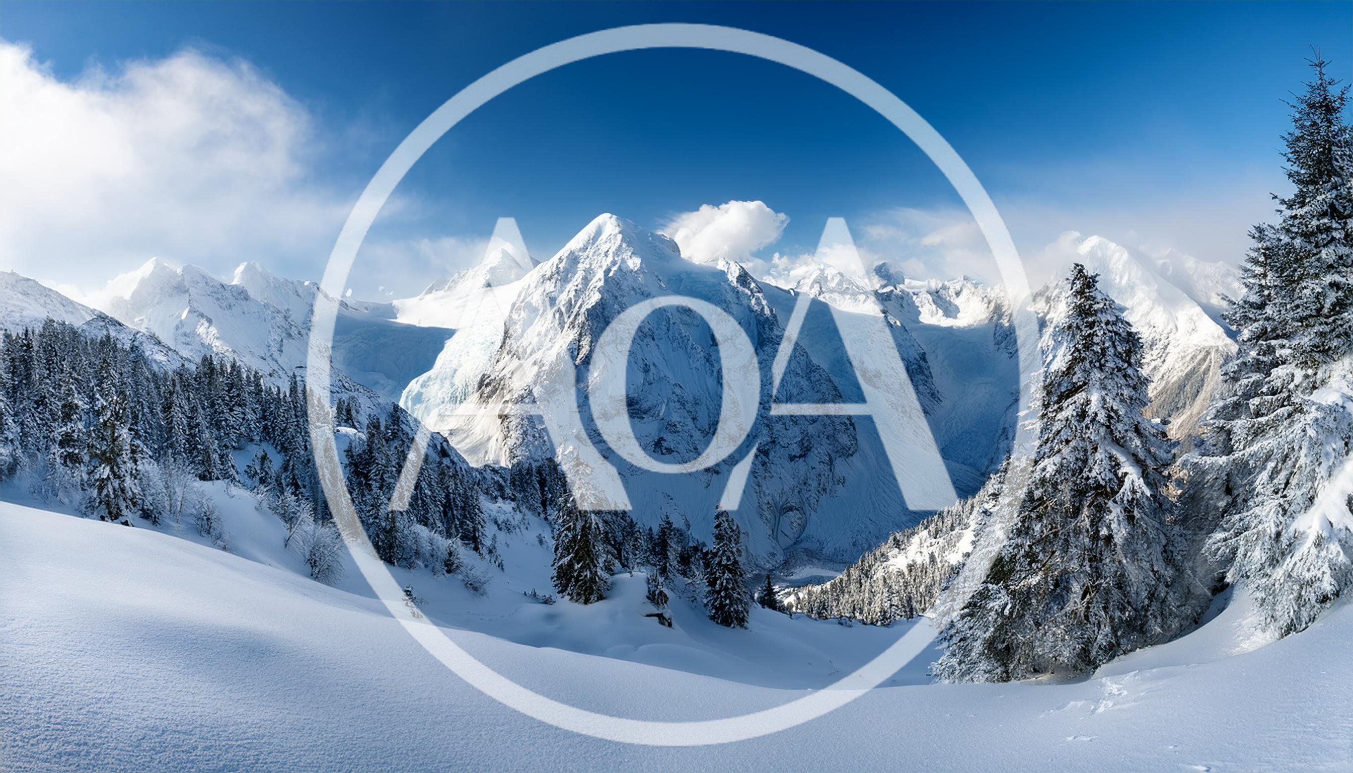 Panoramic View Of Snow Covered Alpine Mountain Peaks