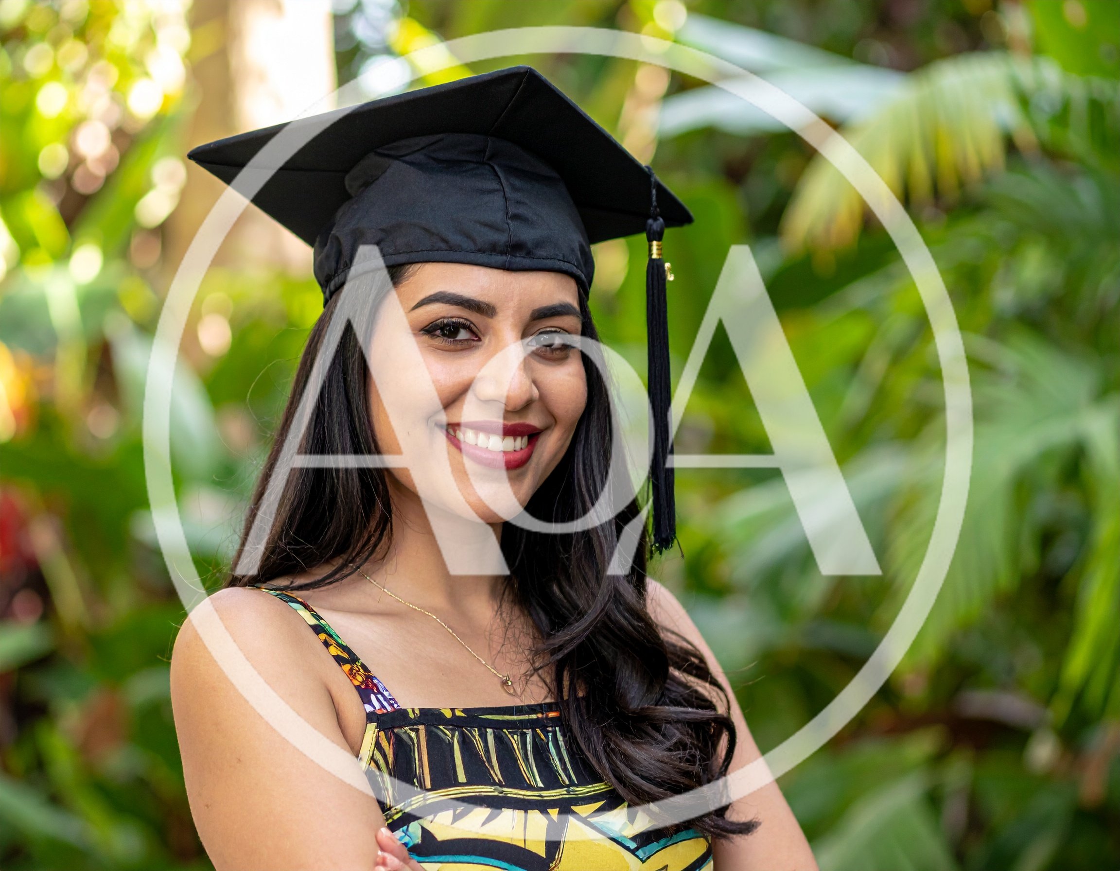 Young Woman Wearing Graduation Cap Outdoors