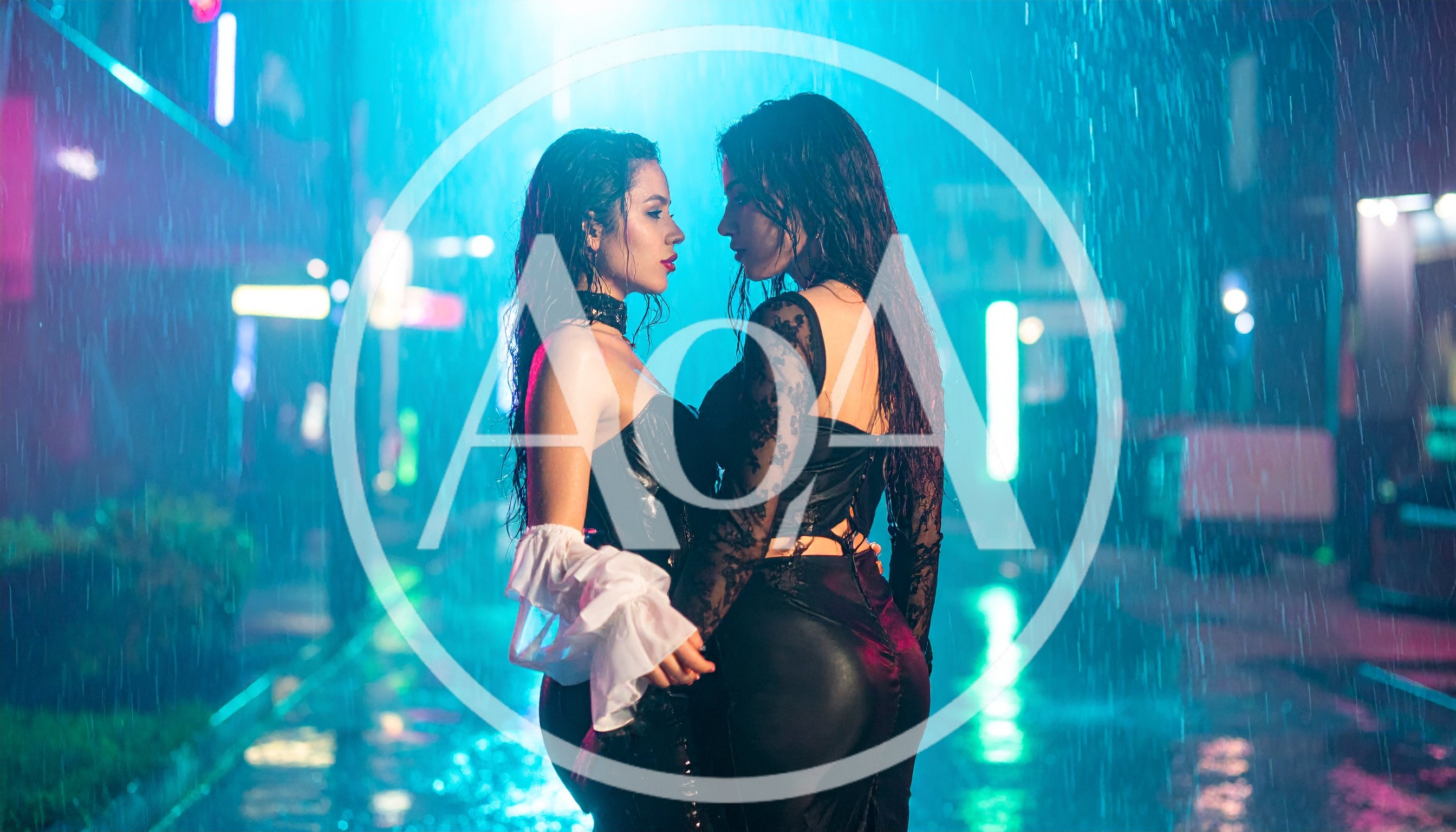 Two Women Embracing Under Rain in Neon City