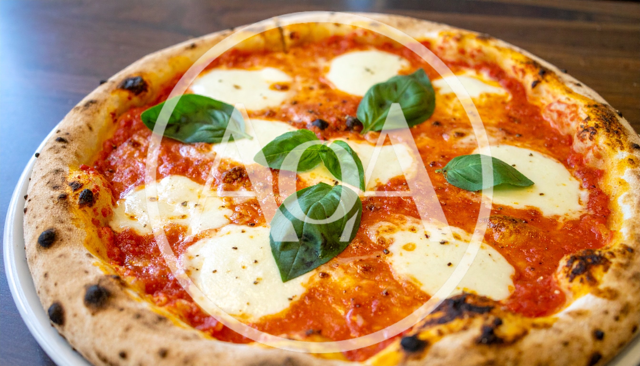 Freshly Baked Neapolitan Margherita Pizza With Basil