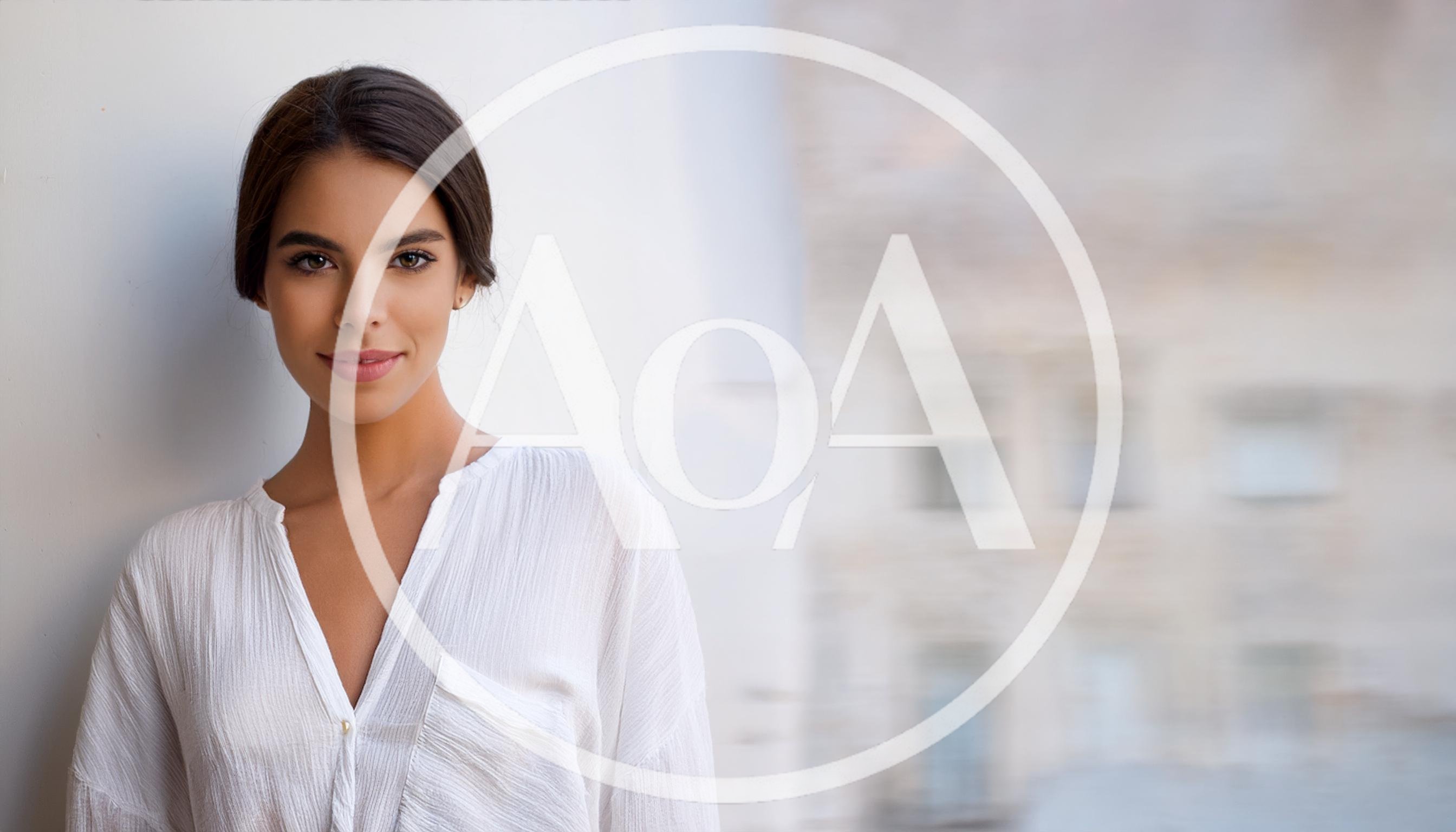 Portrait Of A Beautiful Young Woman In White Shirt