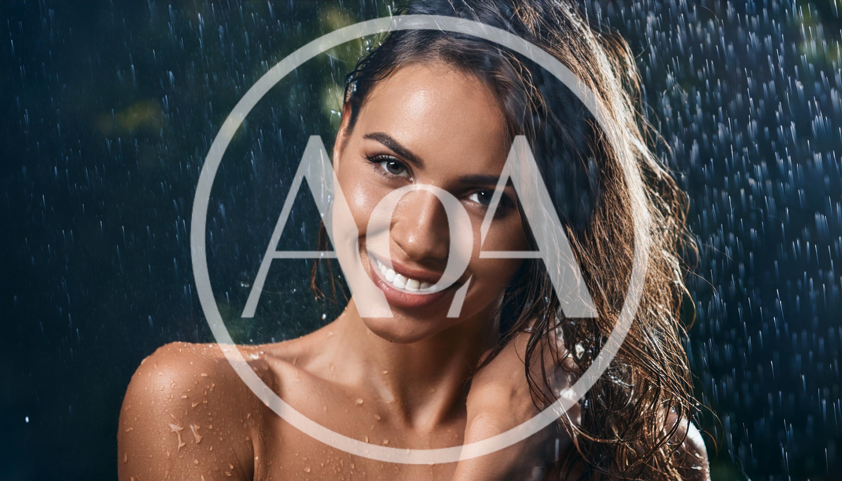 Beautiful Woman Smiling Under Rain Shower