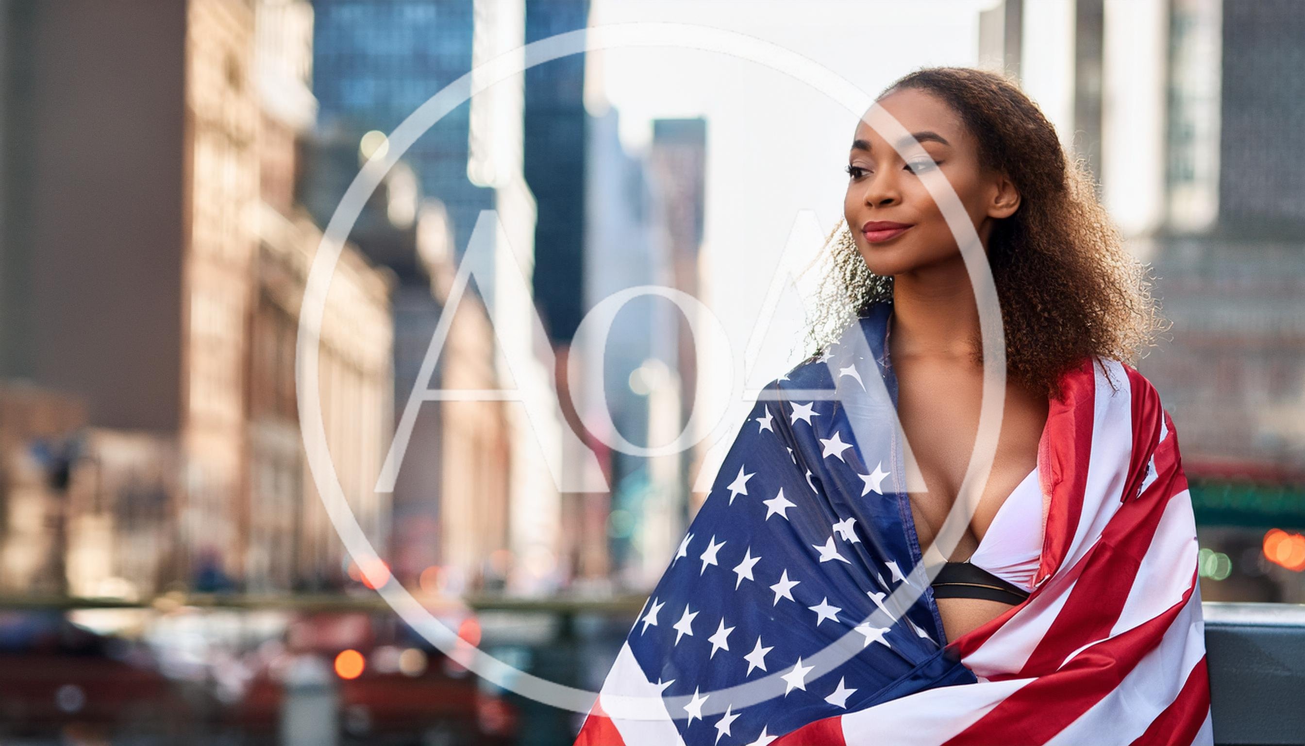 Young Woman Wrapped In American Flag In New York City