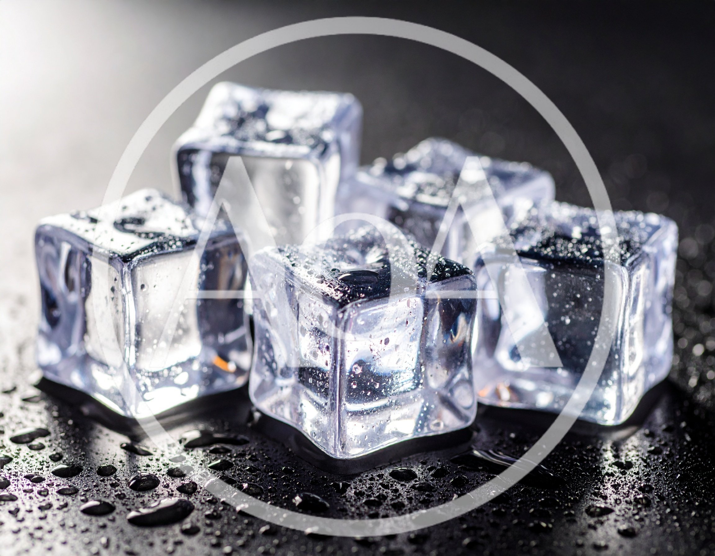 Clear Ice Cubes With Water Droplets On Dark Surface
