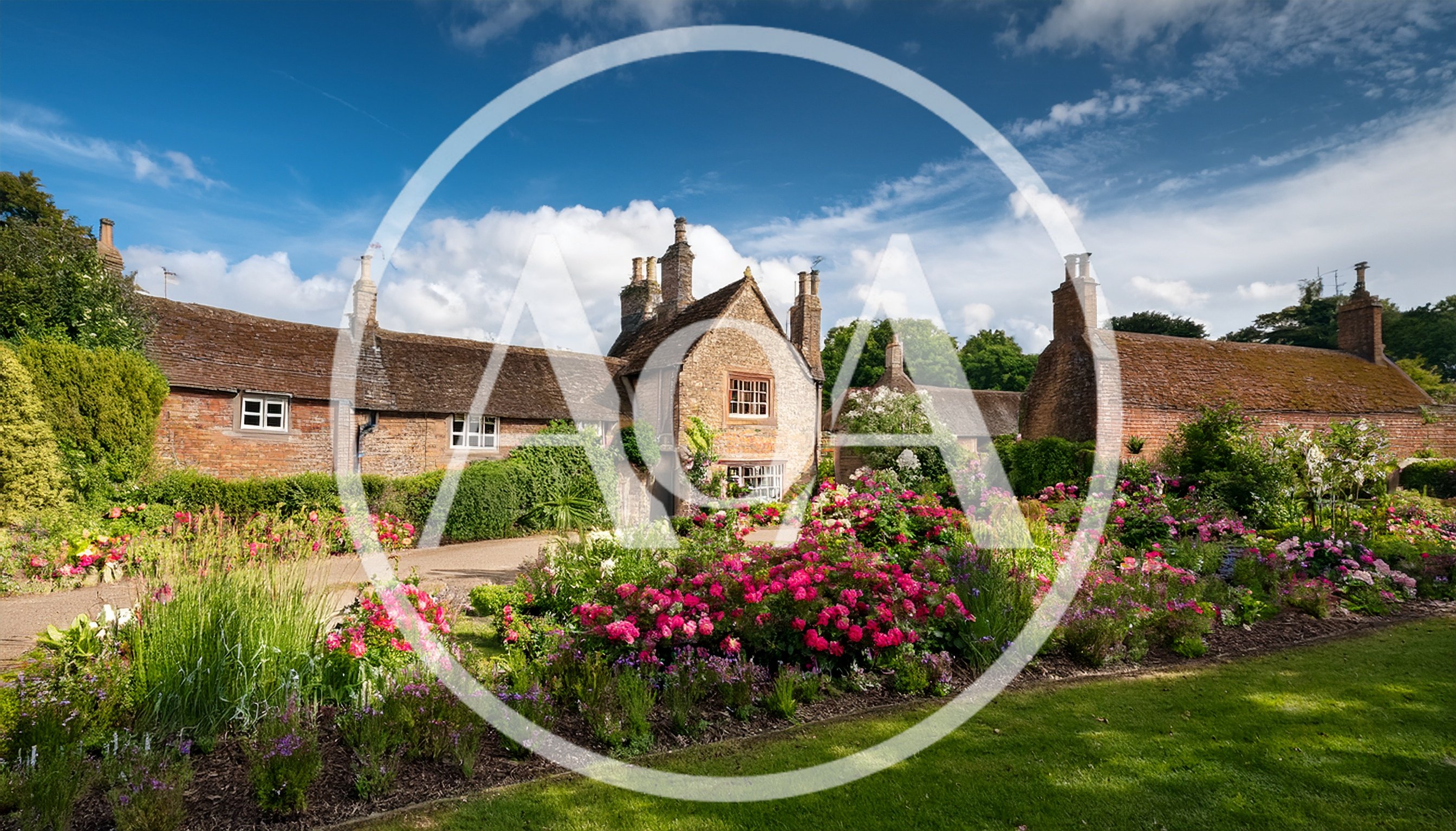 Traditional English Stone Cottage With Vibrant Flower Garden