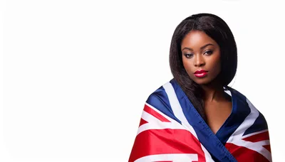 Portrait Of A Young Black Woman Wrapped In British Flag