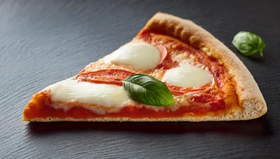 Single Slice Of Margherita Pizza On Black Slate