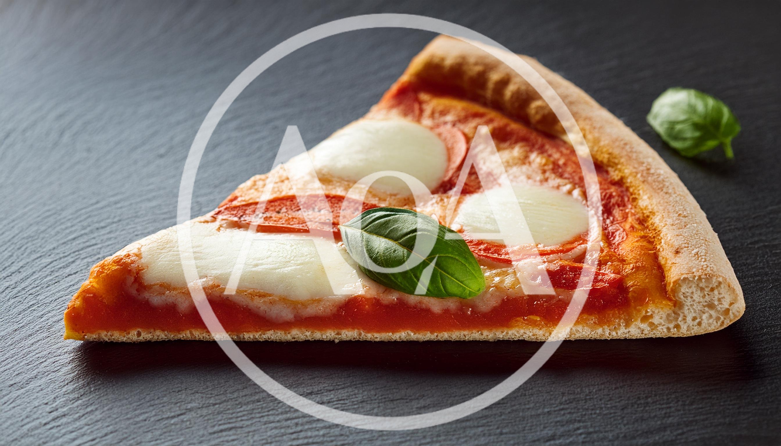 Single Slice Of Margherita Pizza On Black Slate