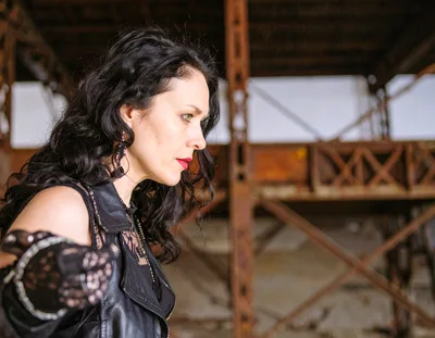 Gothic Woman Posing in Abandoned Industrial Building