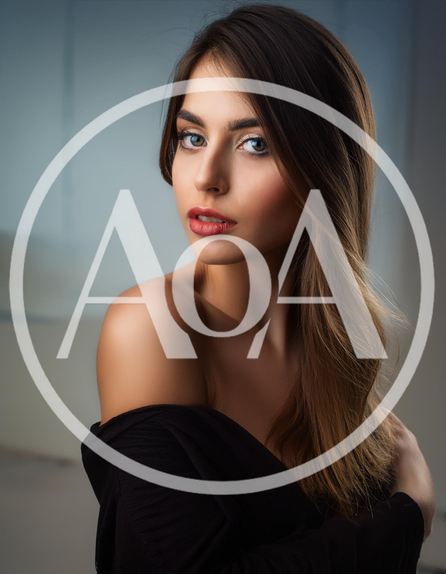 Portrait Of A Beautiful Young Woman Looking Over Shoulder