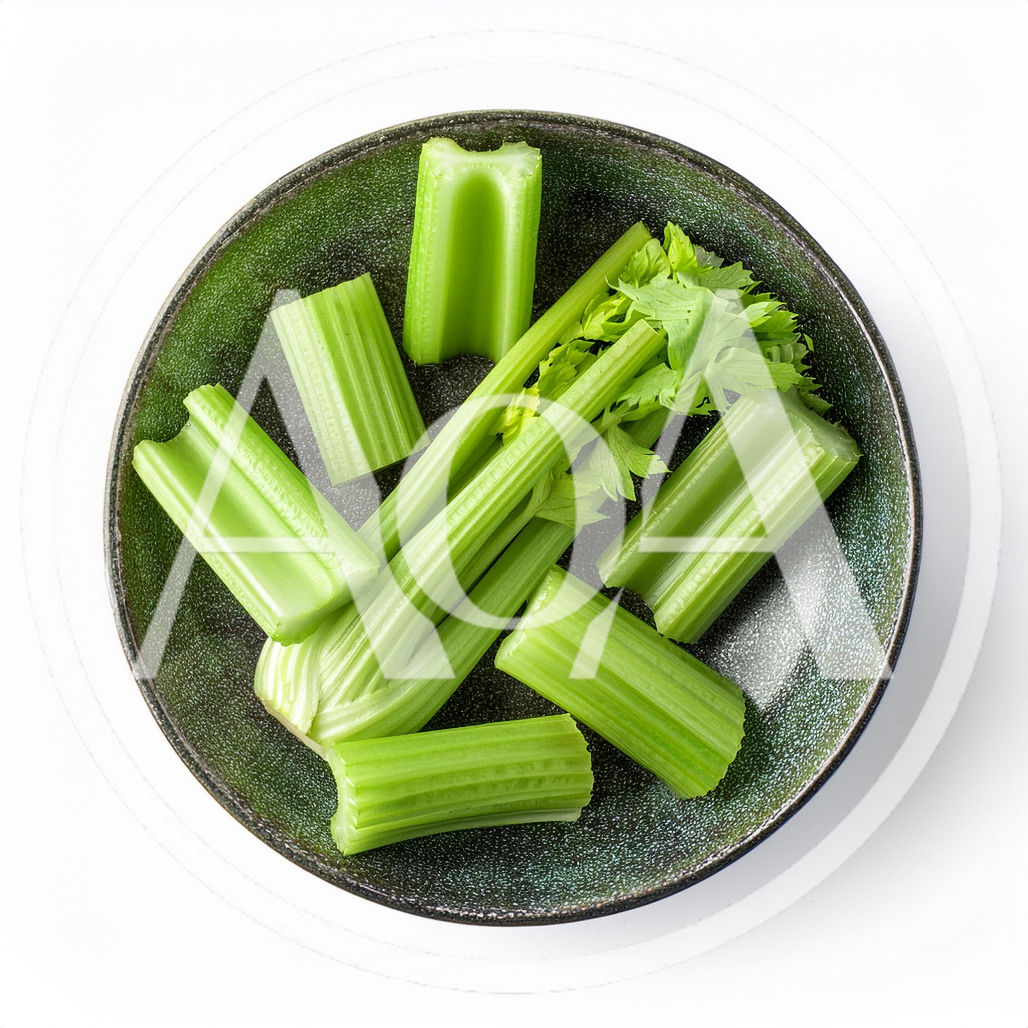 Fresh Celery Stalks In A Dark Green Bowl
