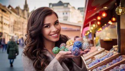 Young Woman Holding Colorful Christmas Ornaments at Market