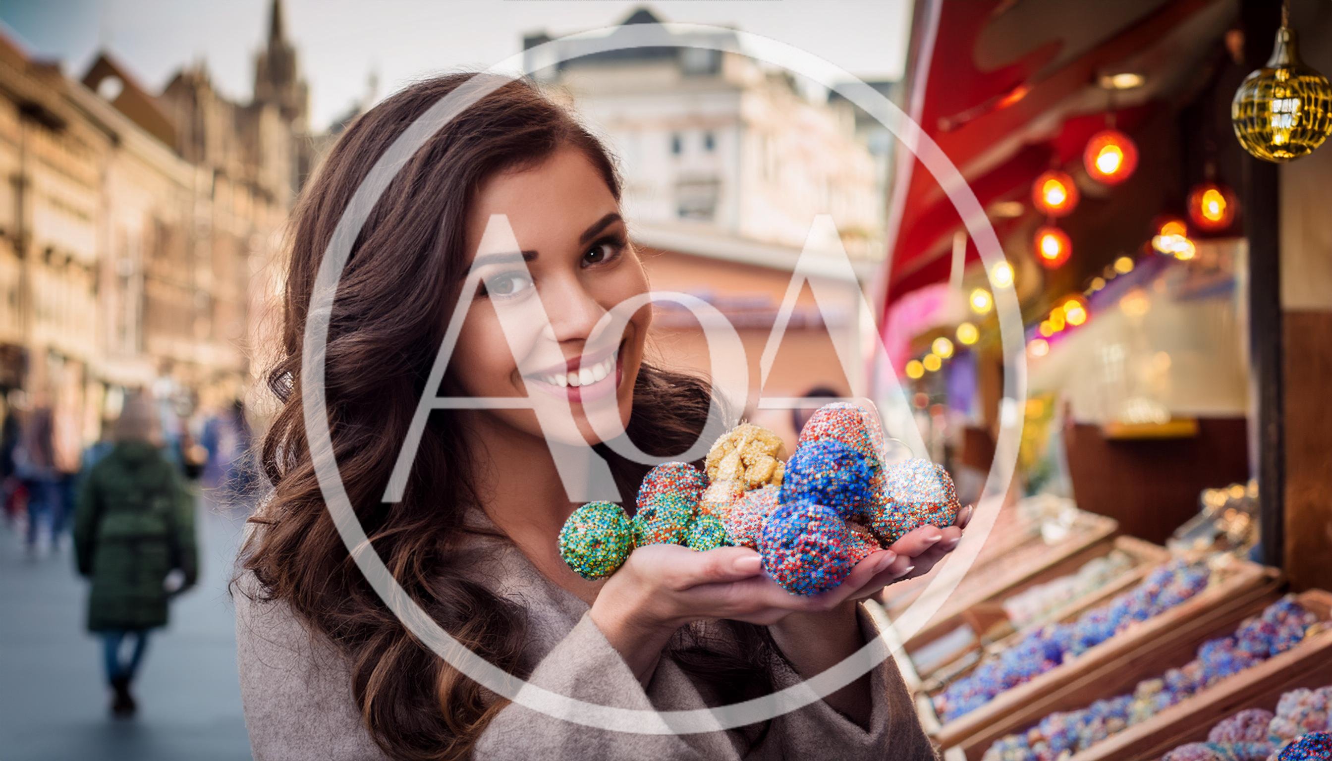 Young Woman Holding Colorful Christmas Ornaments at Market