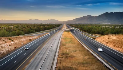 Aerial View Of A Highway Through A Mountain Landscape