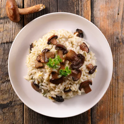 Mushroom Risotto Served On A White Plate