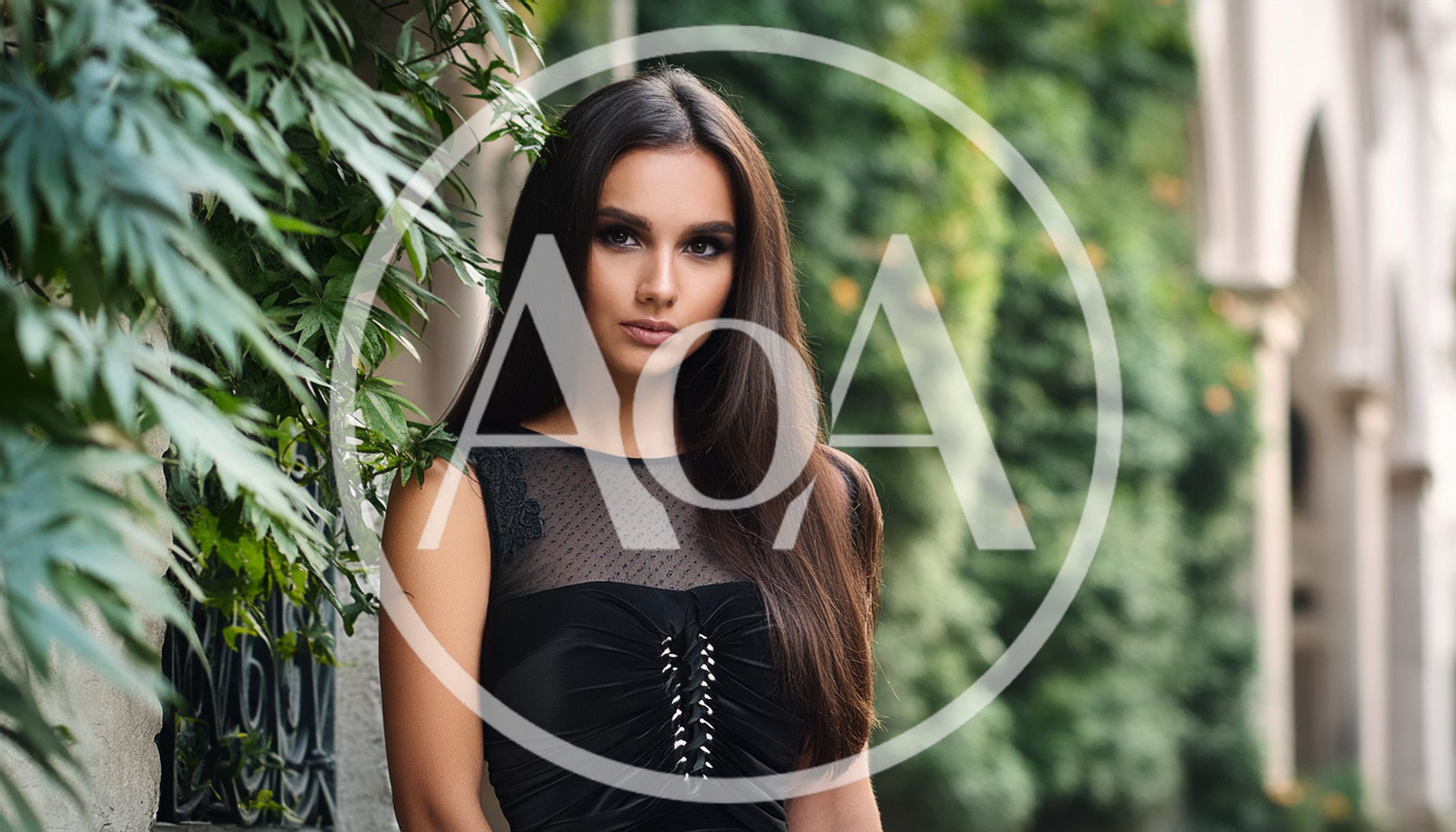 Portrait Of A Beautiful Young Woman In Black Dress