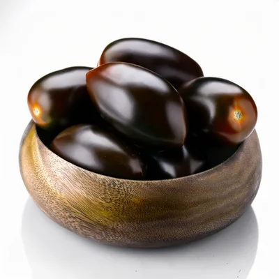Dark Purple Plum Tomatoes In A Wooden Bowl