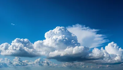 Large Cumulus Clouds Against A Deep Blue Sky