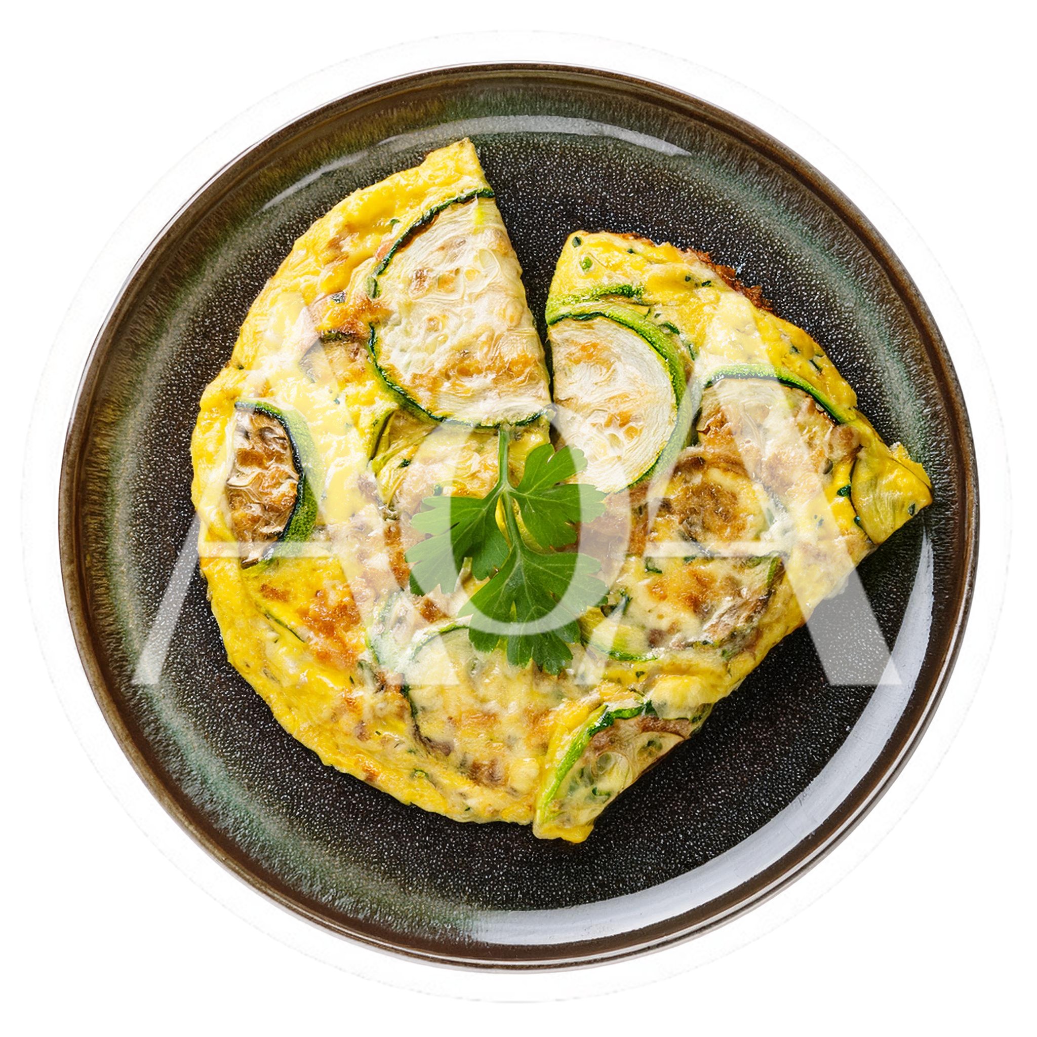 Zucchini Omelet Served On A Dark Ceramic Plate