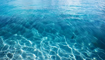 Crystal Clear Blue Ocean Water Surface