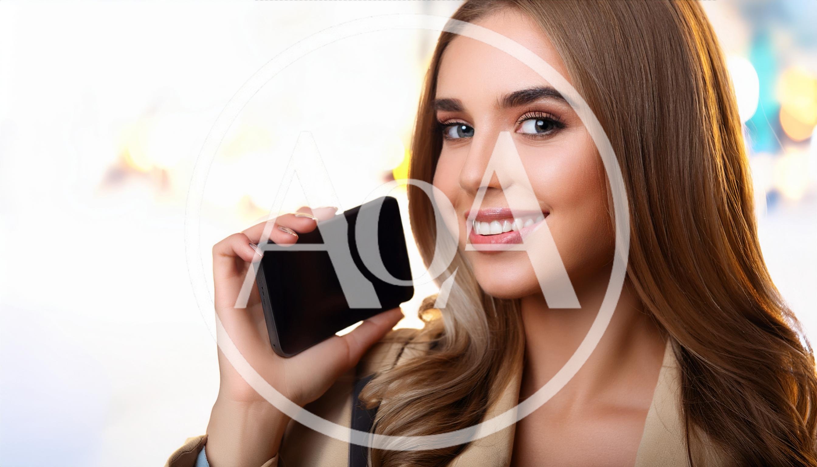 Young Woman Holding A Blank Smartphone