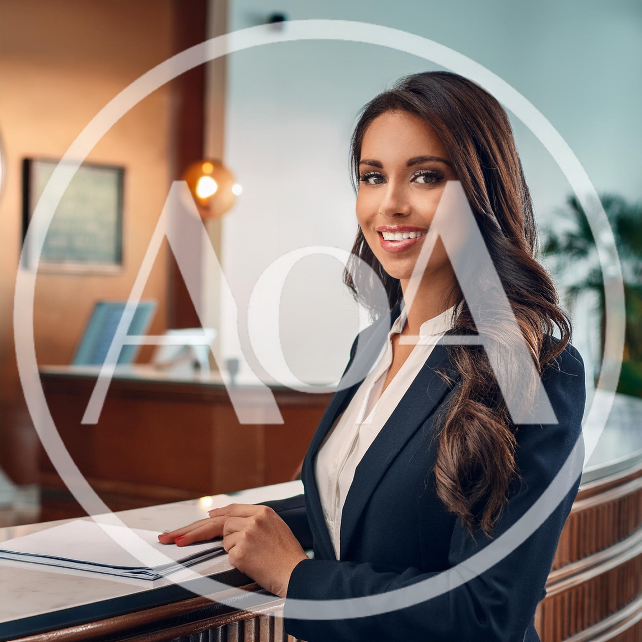 Professional Hotel Receptionist Smiling At Front Desk