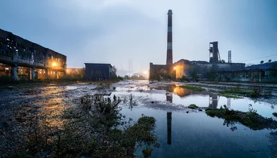 Abandoned Industrial Factory Complex At Twilight