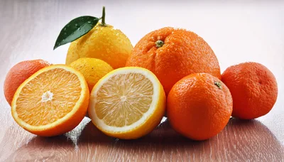 Fresh Citrus Fruits Arrangement on Wooden Surface