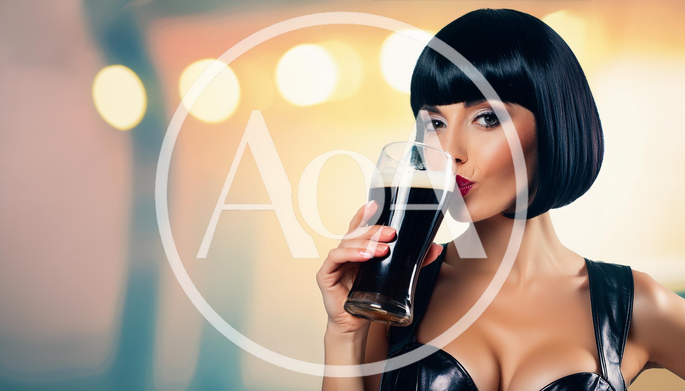 Woman With Bob Haircut Drinking Dark Beer
