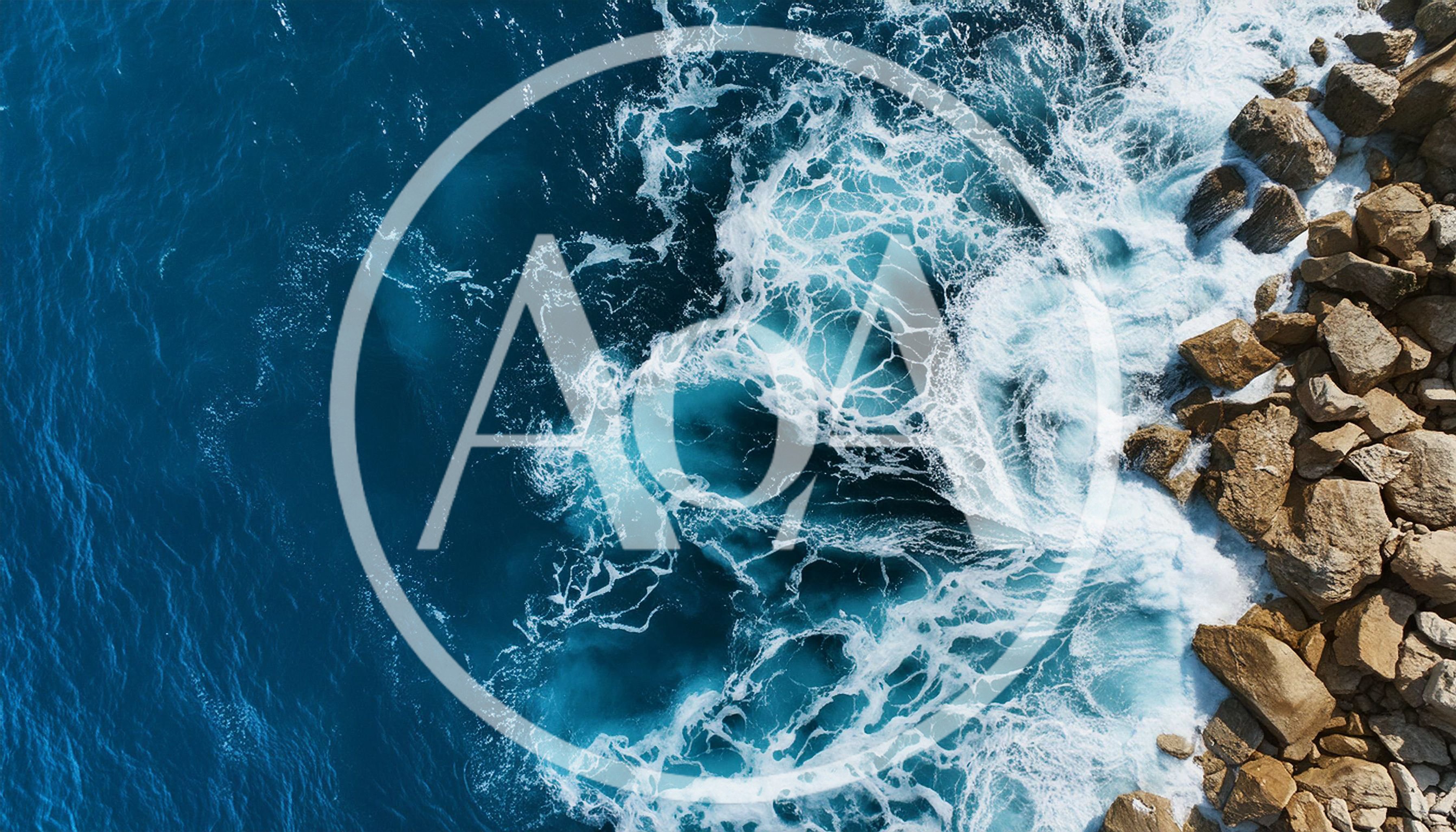 Aerial View Of Ocean Waves Crashing Against Rocky Coastline