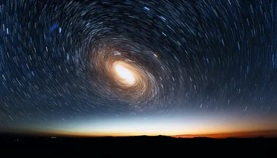 Star Trails Rotating Above A Dark Horizon