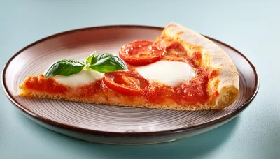 Single Slice Of Margherita Pizza On A Plate