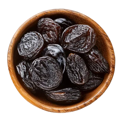 Top View Of Dried Prunes In Wooden Bowl
