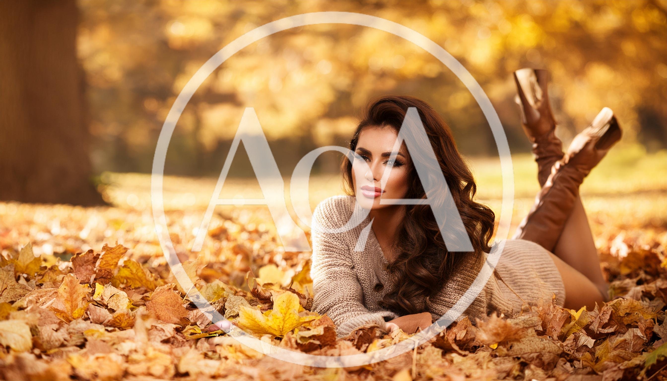 Beautiful Woman Relaxing In Autumn Leaves