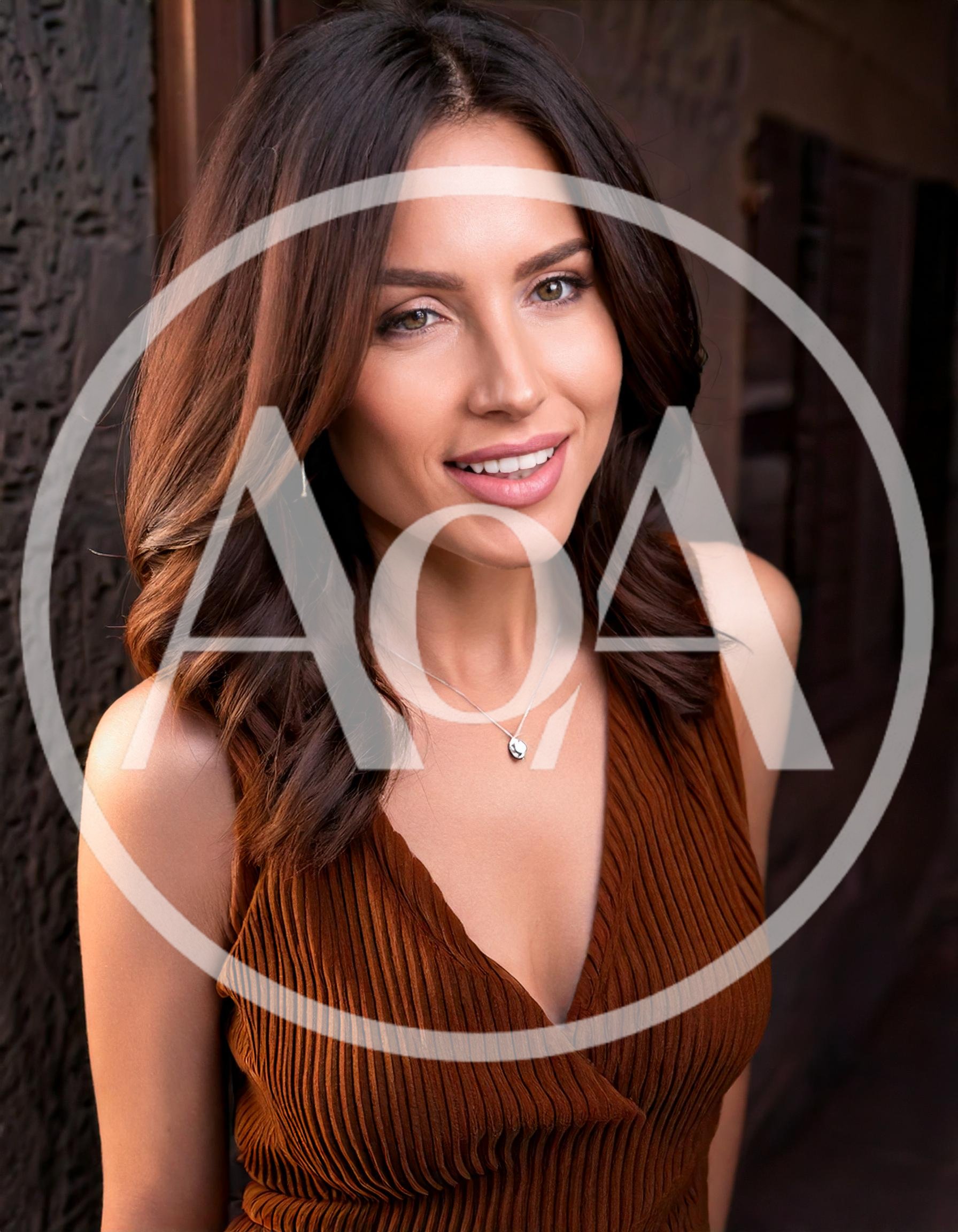 Portrait Of A Beautiful Woman In A Brown Top