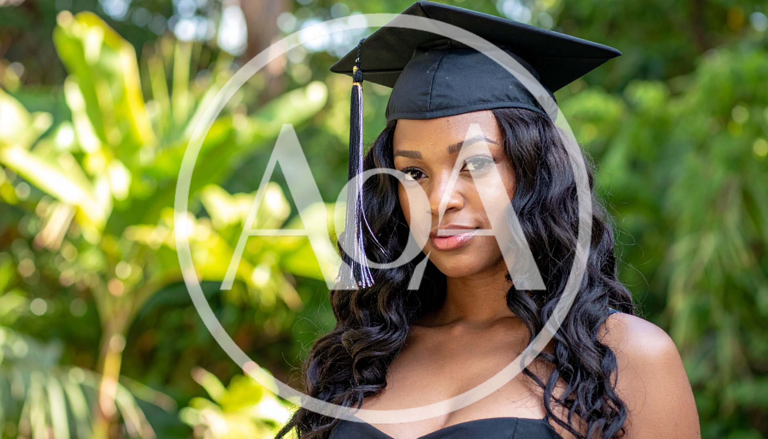 Young African American Woman Wearing Graduation Cap Outdoors
