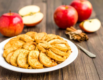 Fresh Apple Tart With Cinnamon Sticks On Wooden Table