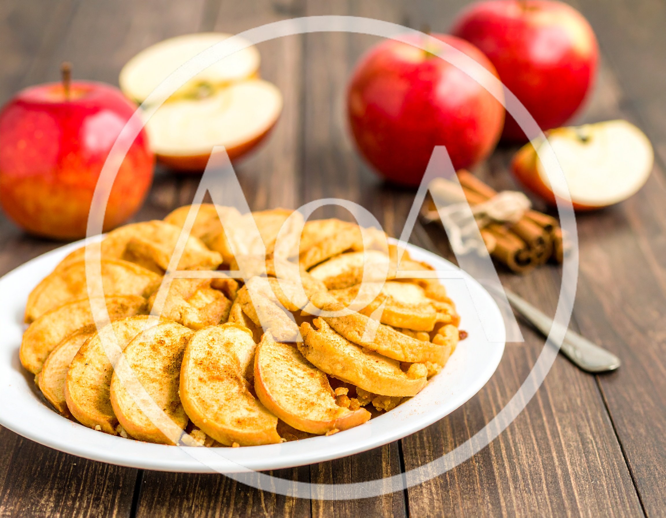 Fresh Apple Tart With Cinnamon Sticks On Wooden Table