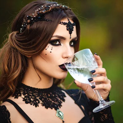 Gothic Woman Drinking From A Crystal Glass