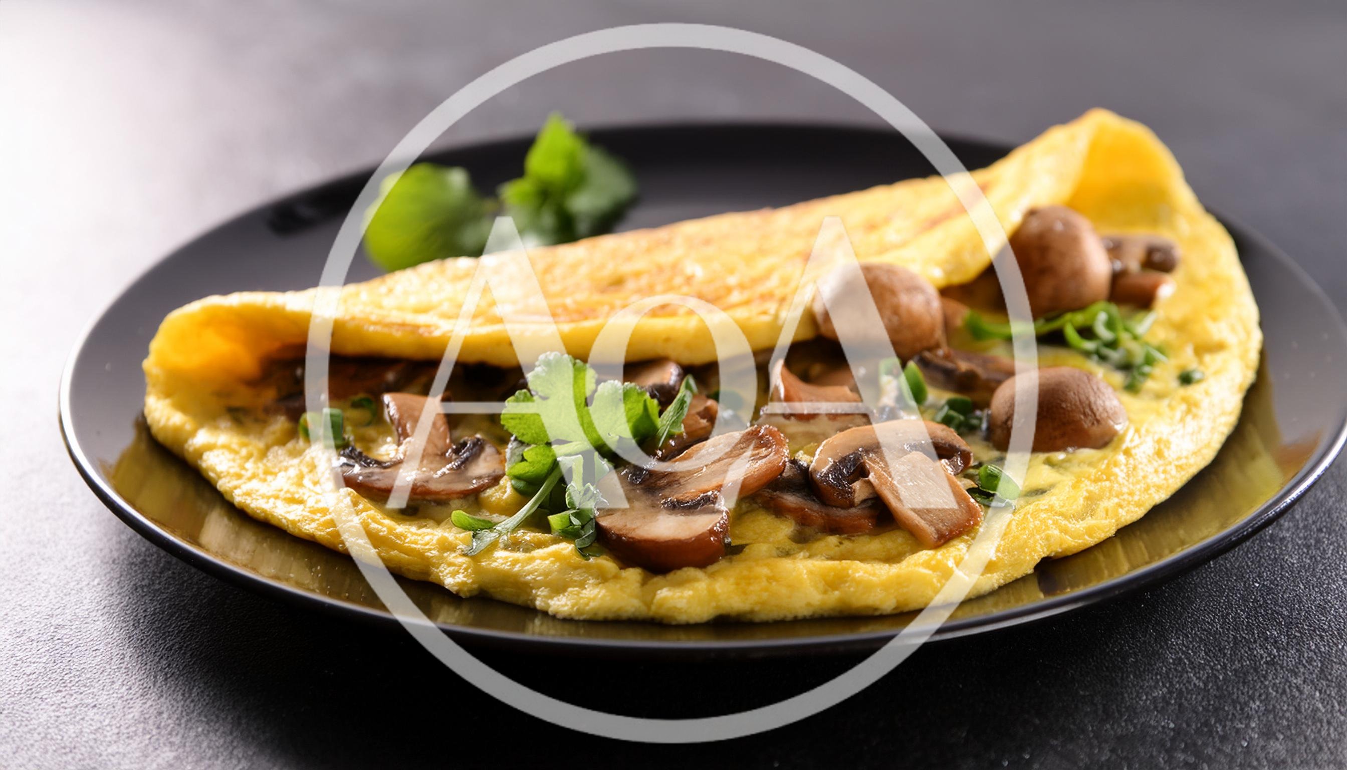 Mushroom Omelet Served On A Black Plate