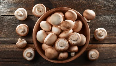 Fresh Brown Cremini Mushrooms In A Wooden Bowl