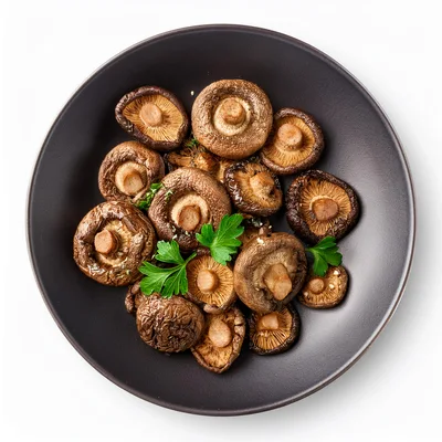 Roasted Shiitake Mushrooms Served On A Dark Plate
