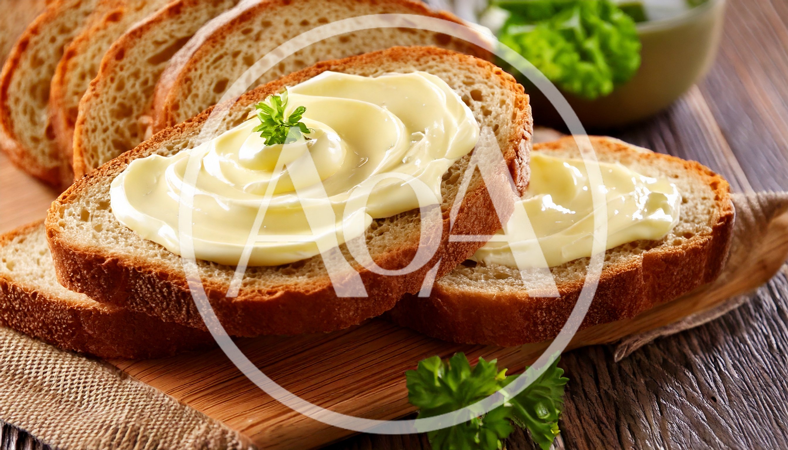 Slices Of Fresh Bread With Creamy Butter
